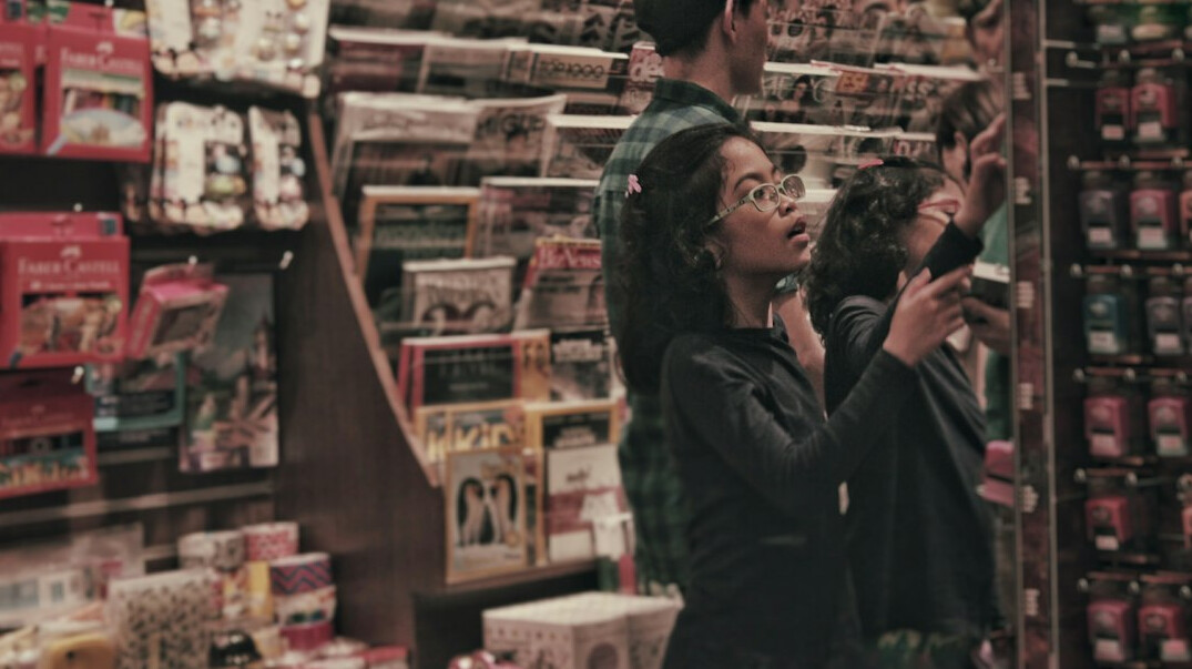 store detective observing shoppers