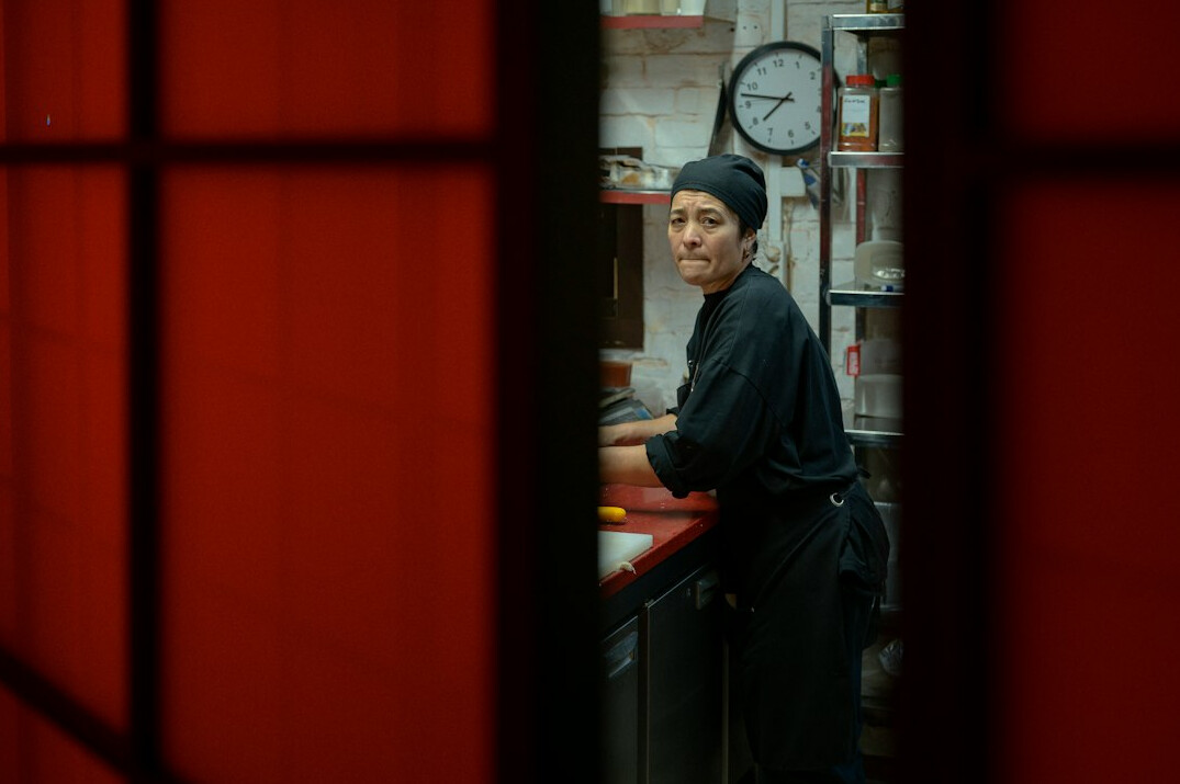store detective watching shoplifters