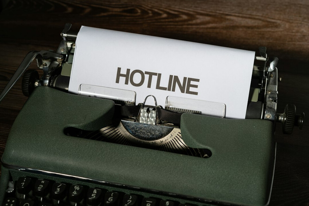 Vintage typewriter with papers and a cup of coffee, investigative journalism theme